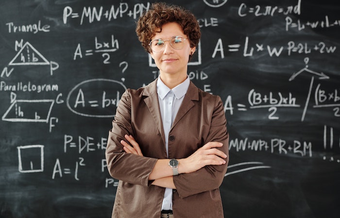 Photo Of Woman Standing In Front Of Blackboard - career change for teachers